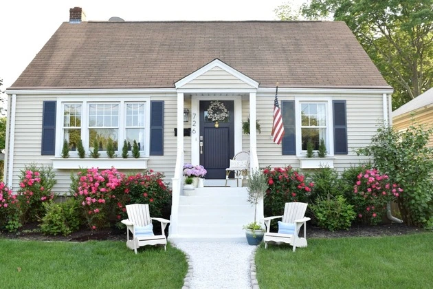 Stylish entryway with roofing, plants, and decor